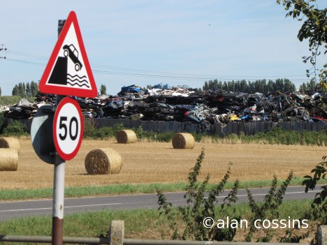 Car toppling into scrapyard